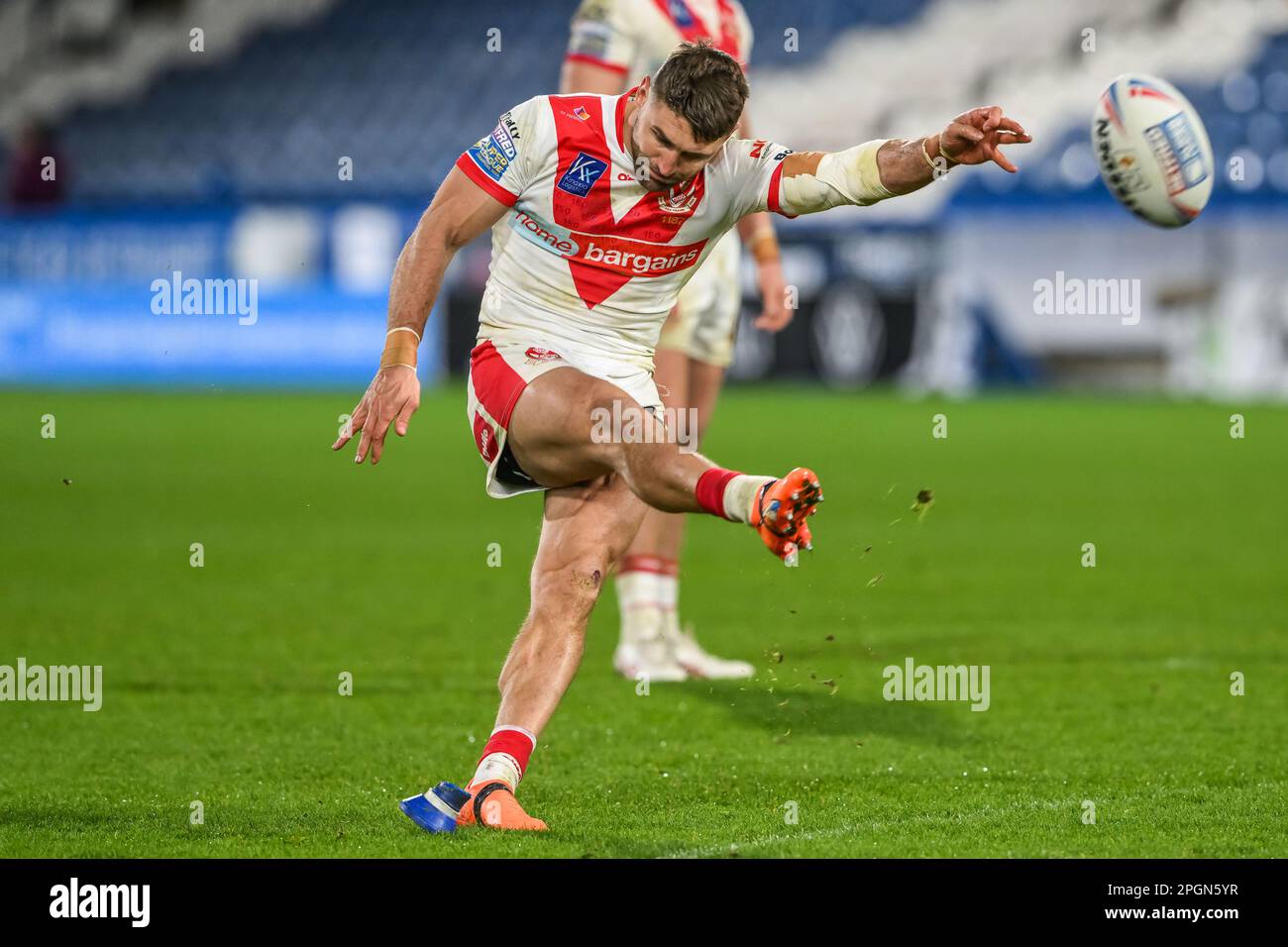 Tommy Makinson #2 of St Helens kicks a penalty during the Betfred Super League Round 6 match Huddersfield Giants vs St Helens at John Smith's Stadium, Huddersfield, United Kingdom, 23rd March 2023  (Photo by Craig Thomas/News Images) Stock Photo