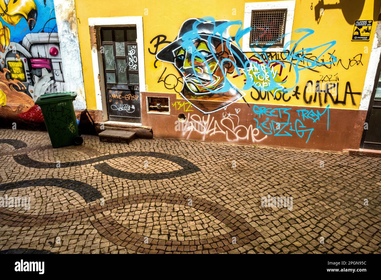 Colorful wall, sidewalk and grafitti in Lagos, Portugal Stock Photo
