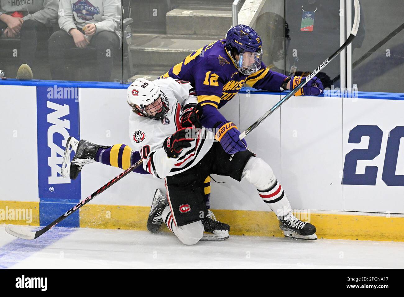 December 6, 2020 Nebraska-Omaha Mavericks forward Martin Sundberg (16)  holds St. Cloud State Huskies forward Zach Okabe (14) against the boards  during a NCAA D1 men's hockey game between the University of