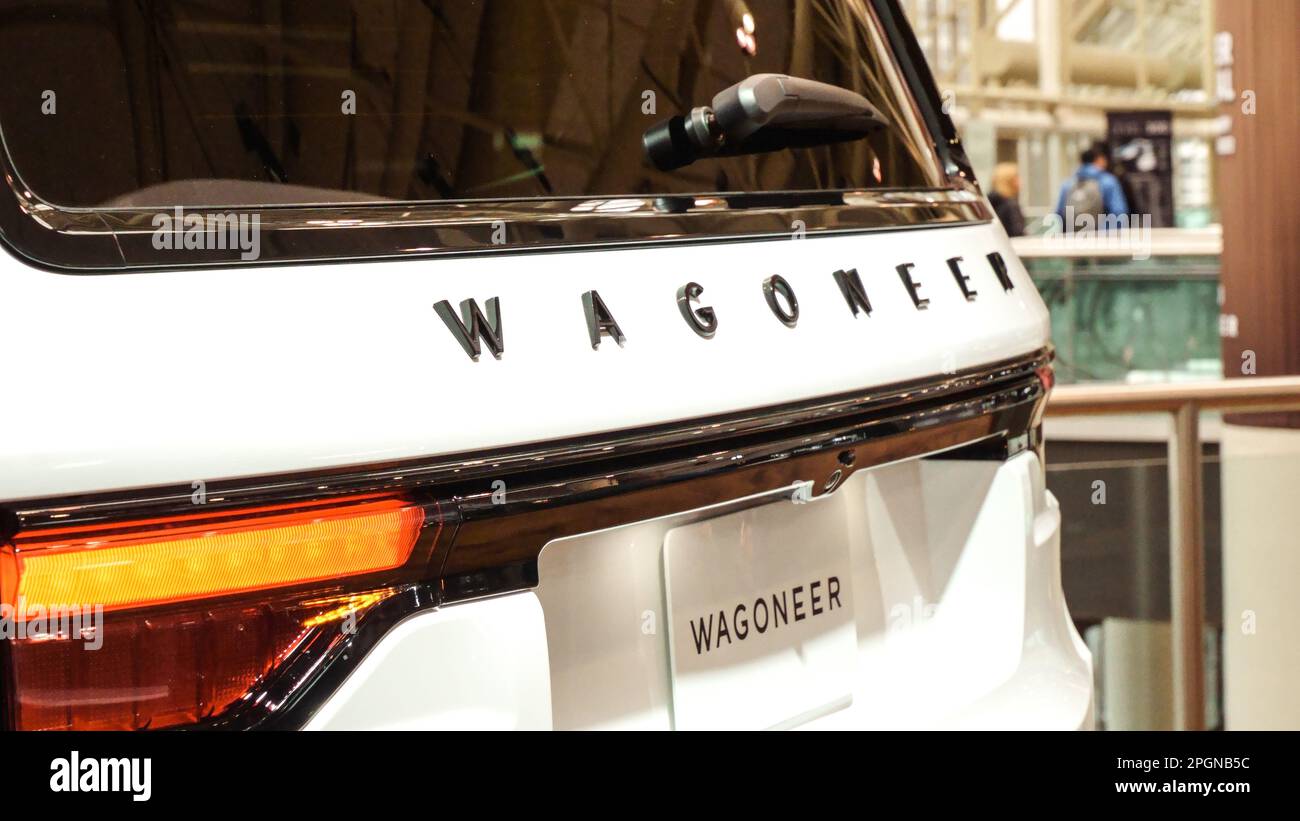 Close view of white Wagoneer truck on display. Crowds looking at new car models at Auto show. National Canadian Auto Show with many car brands. Toront Stock Photo