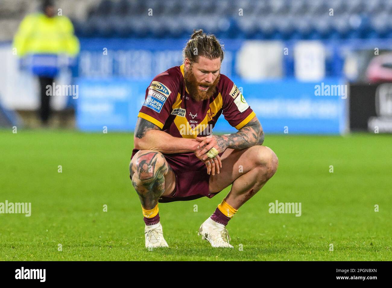 Chris McQueen #12 of Huddersfield Giants is dejected at the final whistle during the Betfred Super League Round 6 match Huddersfield Giants vs St Helens at John Smith's Stadium, Huddersfield, United Kingdom, 23rd March 2023  (Photo by Craig Thomas/News Images) Stock Photo