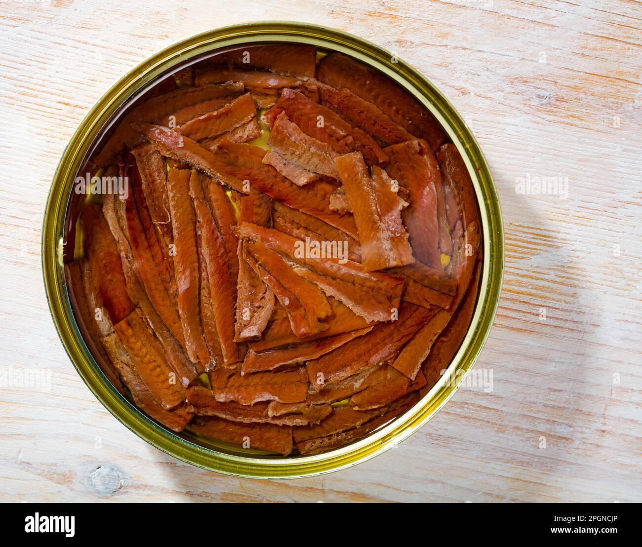 Traditional spanish canned food salted anchovy fillets in oil, nobody