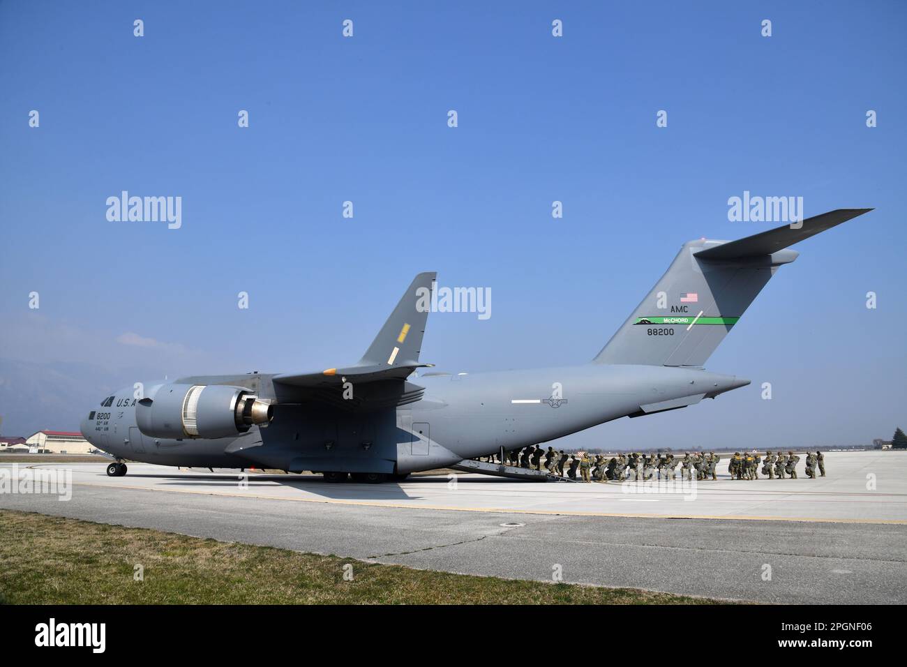 US Army Paratroopers assigned to 2nd Battalion, 503rd Parachute Infantry Regiment, 173rd Airborne Brigade, load a C-17 from 446th Airlift Wing, in preparation for an airborne operation in commemoration of the 20th anniversary of Operation Northern Delay at Aviano Air Base, Italy on March 22, 2023. Operation Northern Delay occurred on 26 March 2003 as part of the 2003 invasion of Iraq. It involved dropping 1,000 paratroopers from the 173rd Airborne Brigade into Northern Iraq. It was the last large-scale combat parachute operation conducted by the U.S. military since Operation Just Cause. The op Stock Photo