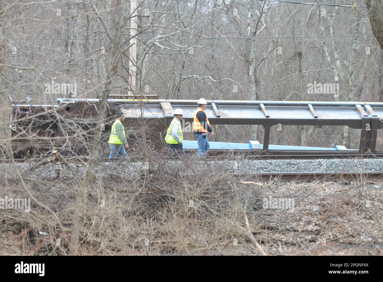 Ayer, Massachusetts, USA. 24th Mar, 2023. Derailed train cars litter