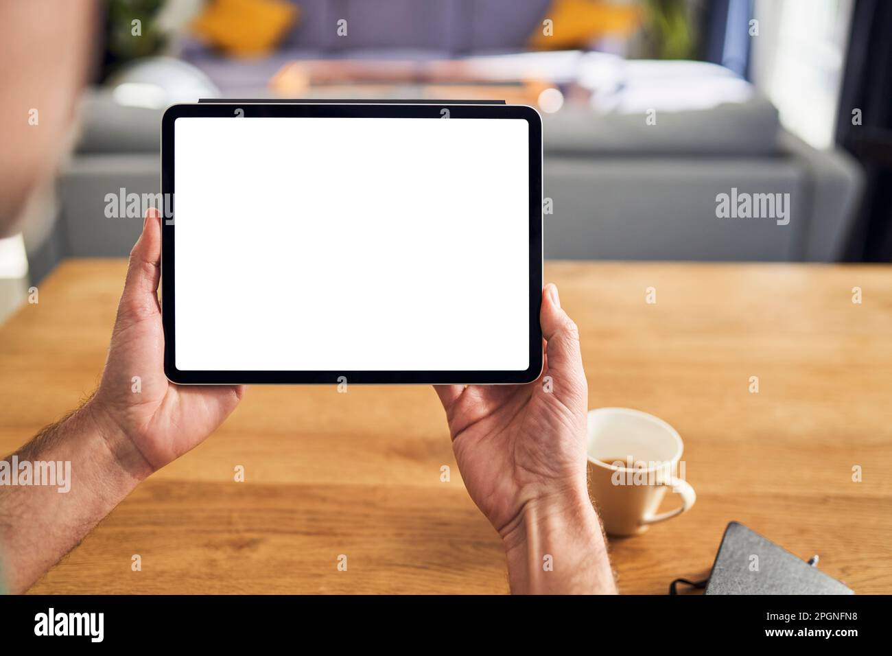Hand holding digital tablette with blank screen Stock Photo