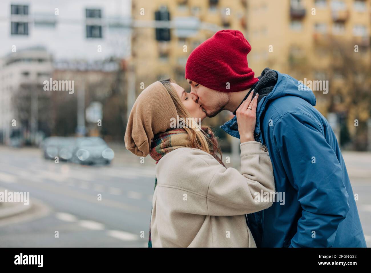 Romantic couple kissing each other at street Stock Photo