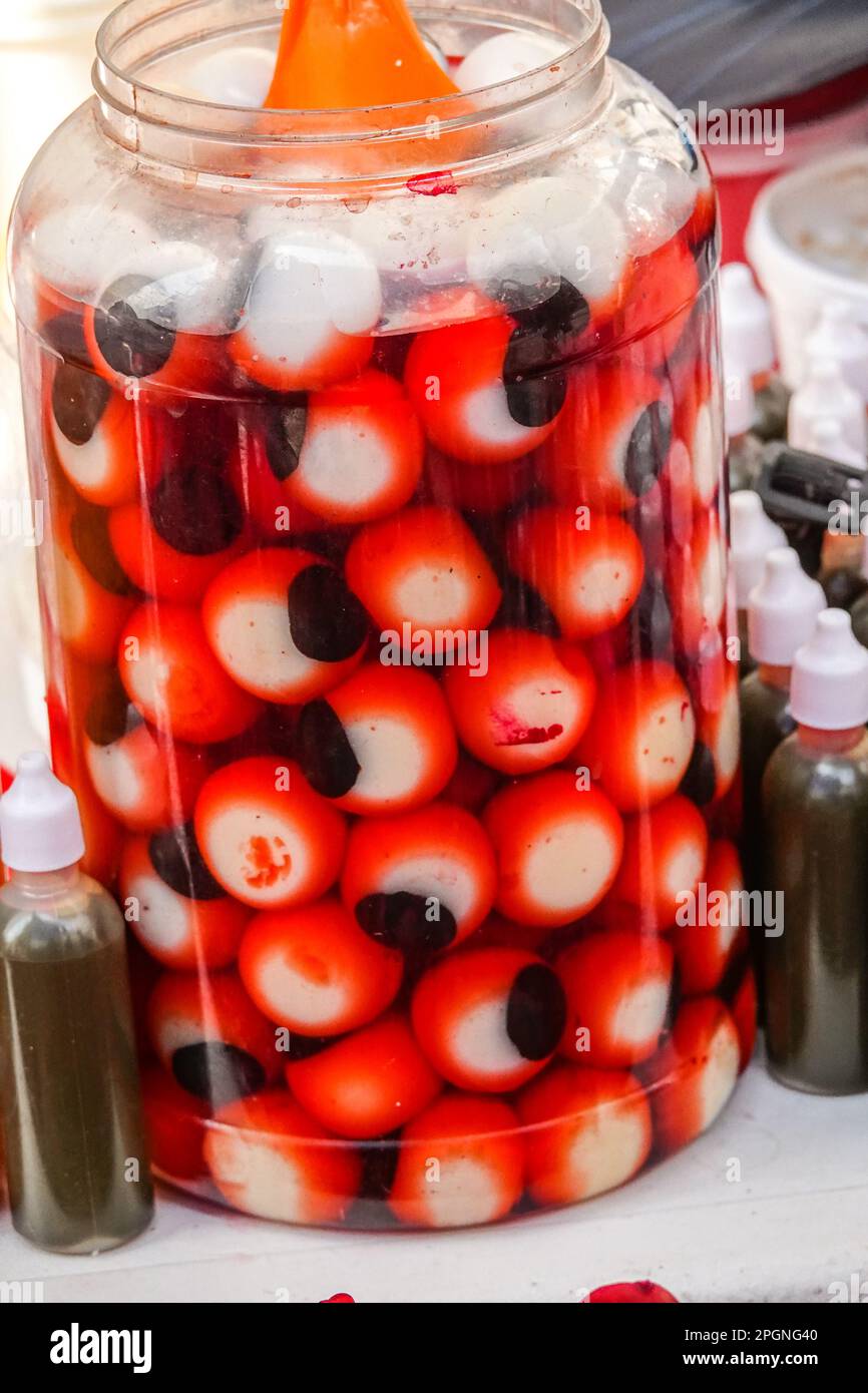 A jar filled with realistic rubber eyeballs for Halloween decoration on