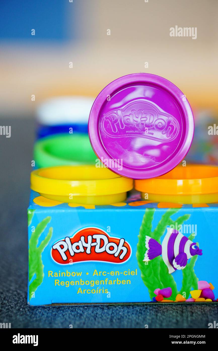 A vertical shot of a multi-colored Play-Doh box Stock Photo