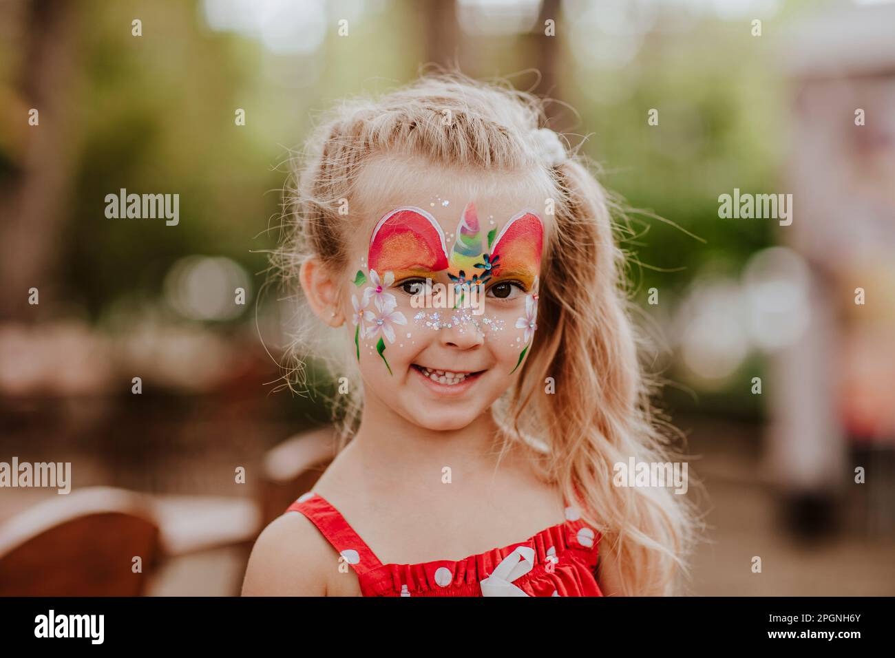 Cute blond girl with face painting Stock Photo