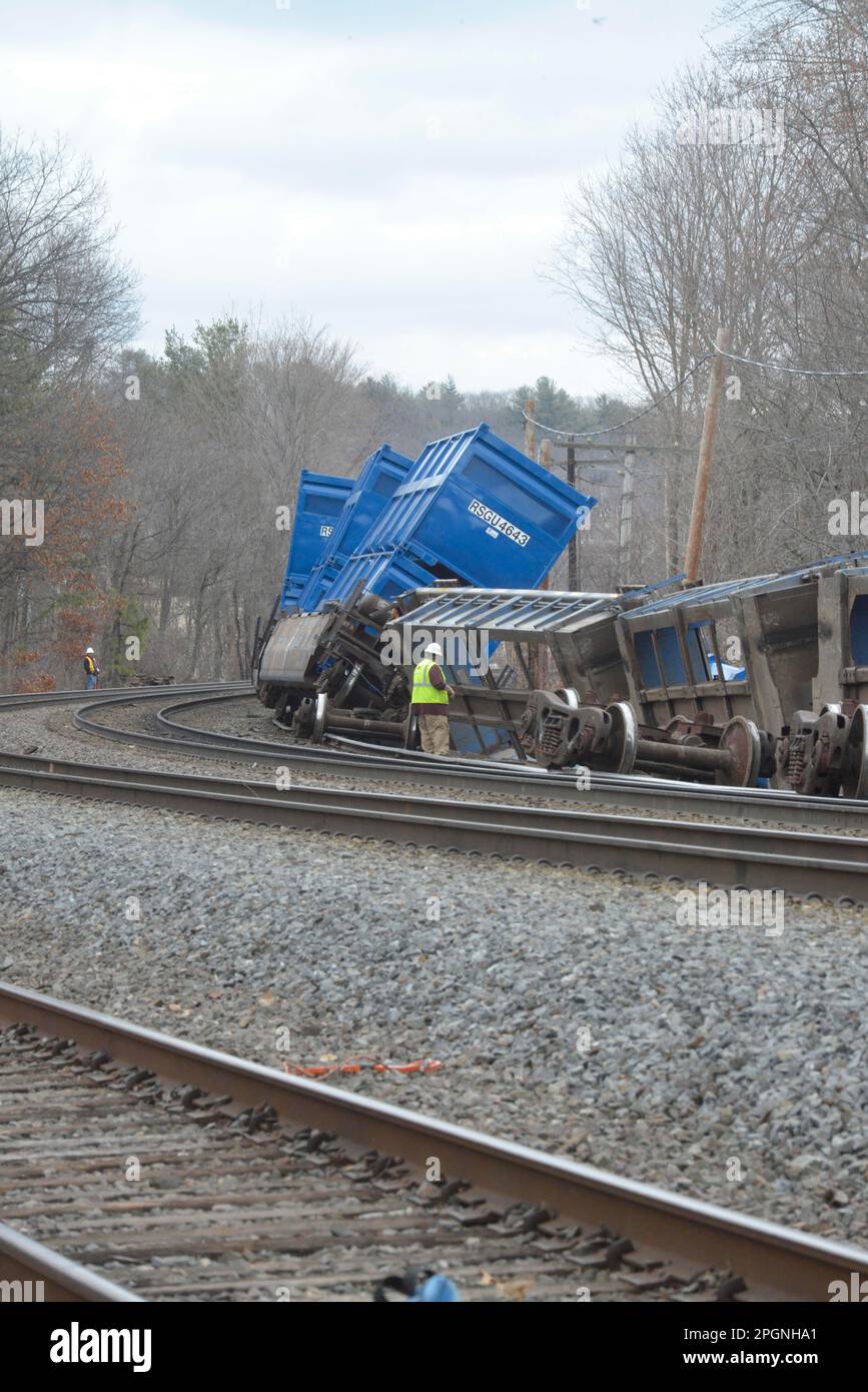 Ayer, Massachusetts, USA. 24th Mar, 2023. Derailed train cars litter