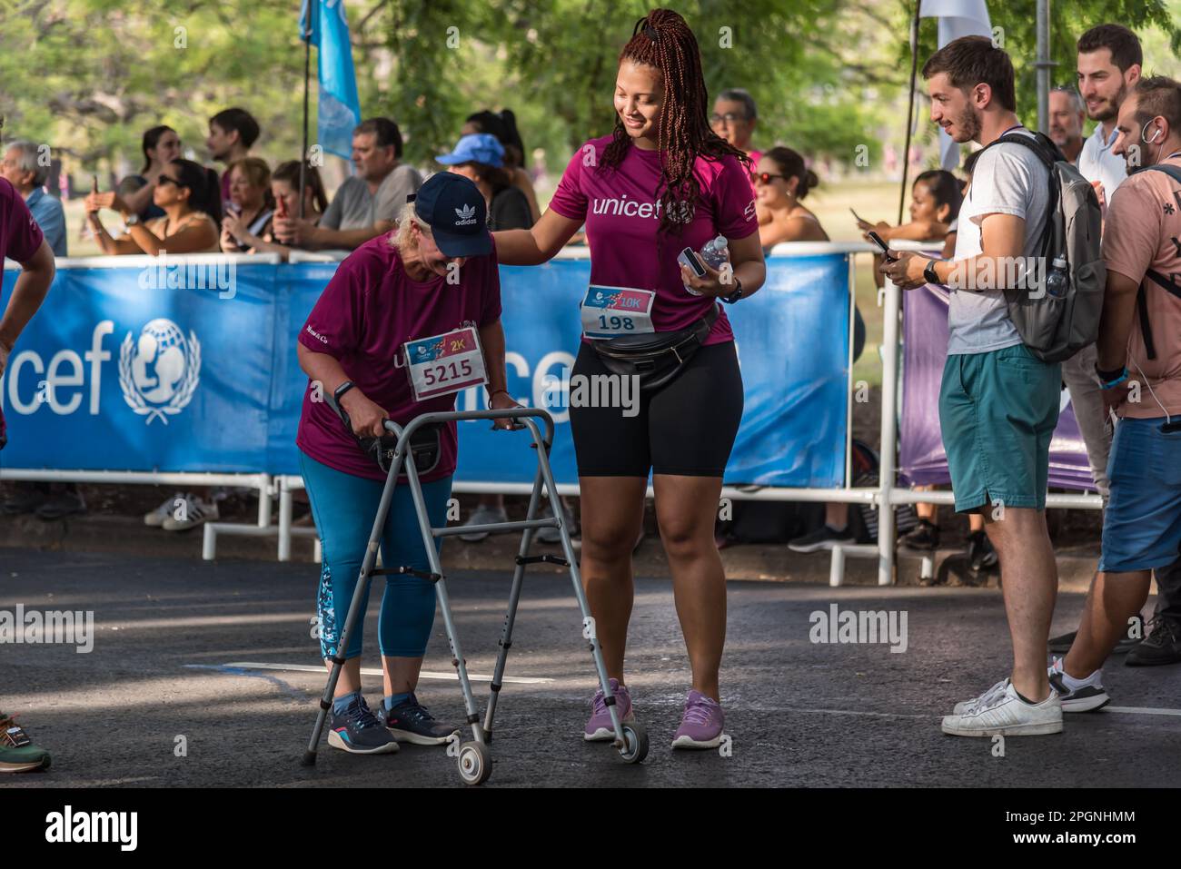 Buenos Aires, Argentina - March 19, 2023: UNICEF Race for Education. Senior woman with disabilities finishes race Stock Photo
