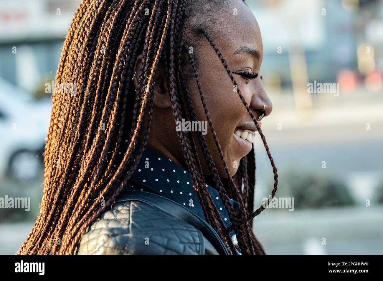 Happy woman with braided hair Stock Photo