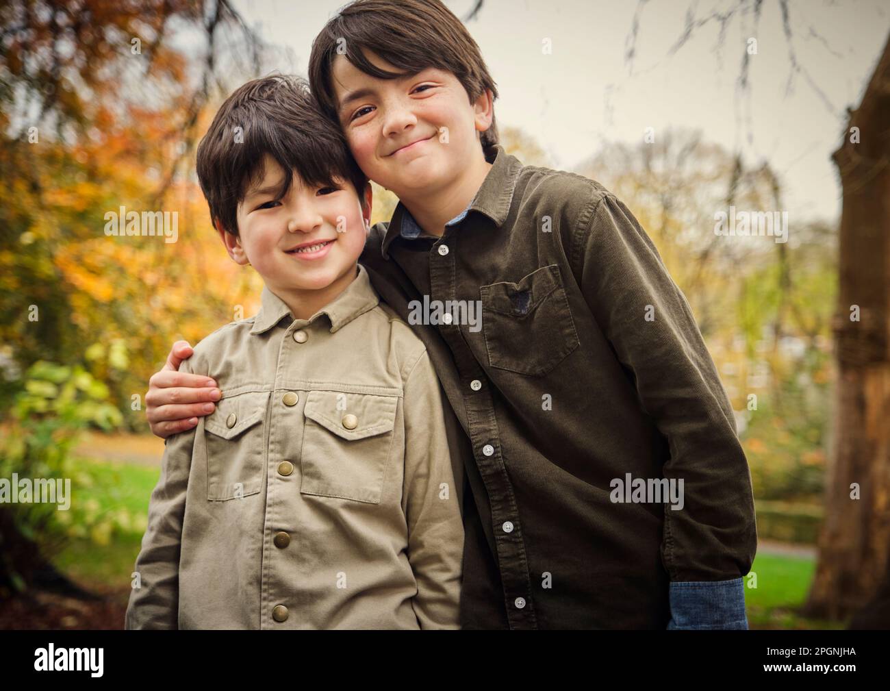 Arm around boy hi-res stock photography and images - Alamy