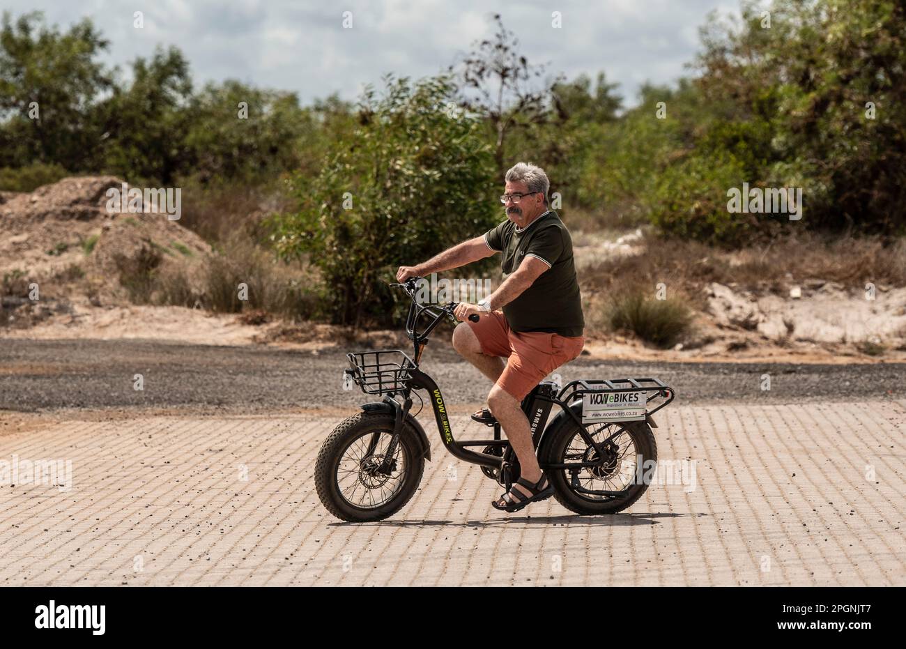 Western Cape, South Africa. 2023. Man riding an electric bike, taking a test drive. Stock Photo