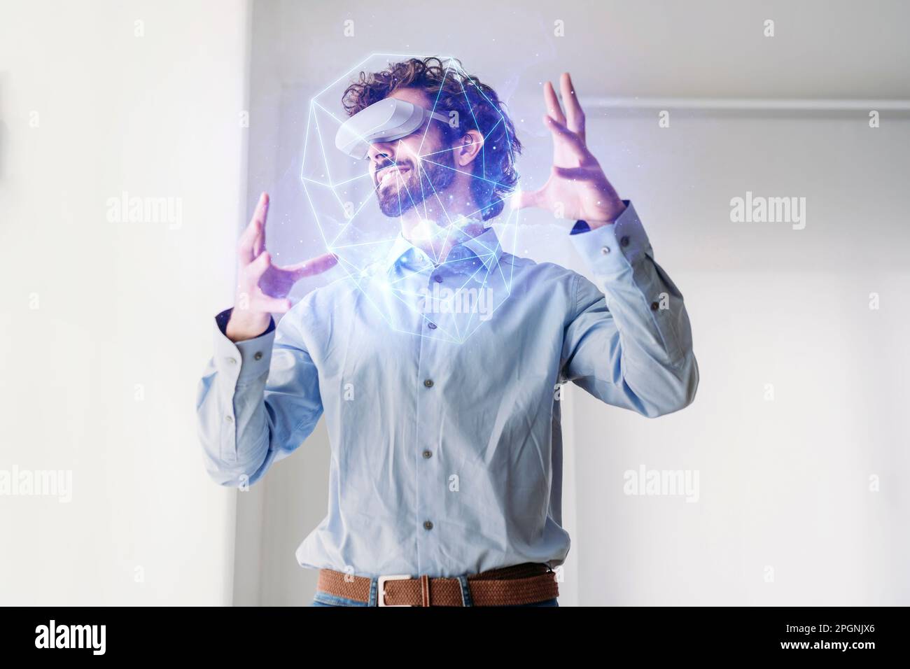 Businessman wearing virtual reality simulator gesturing in office Stock Photo