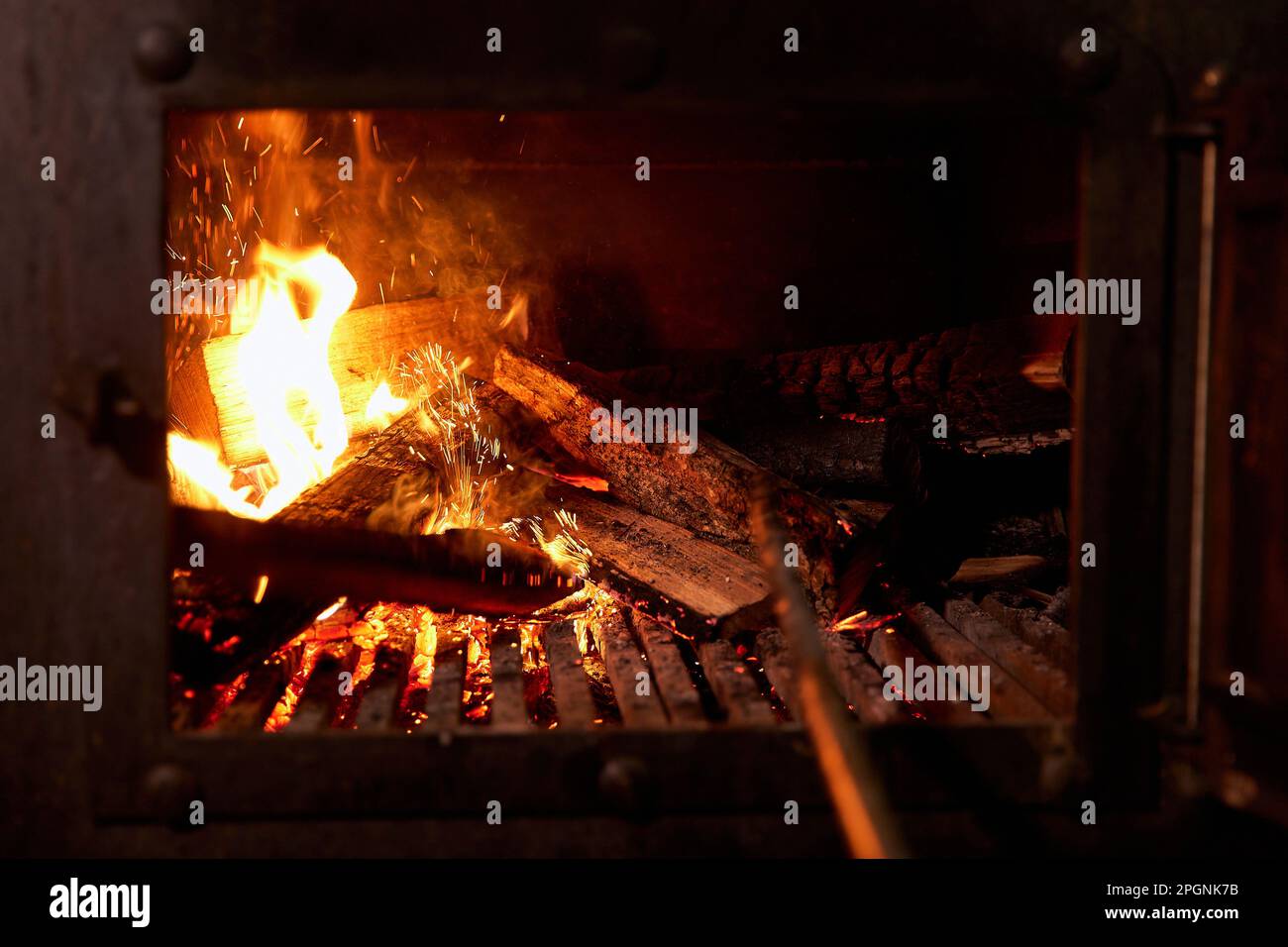 Firewood burning in barbecue grill Stock Photo Alamy