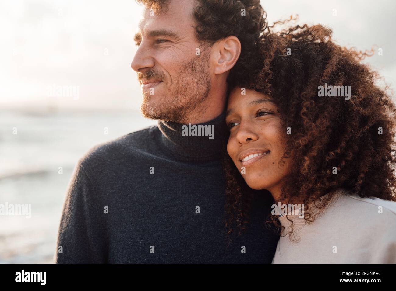 Loving couple spending time together at beach Stock Photo