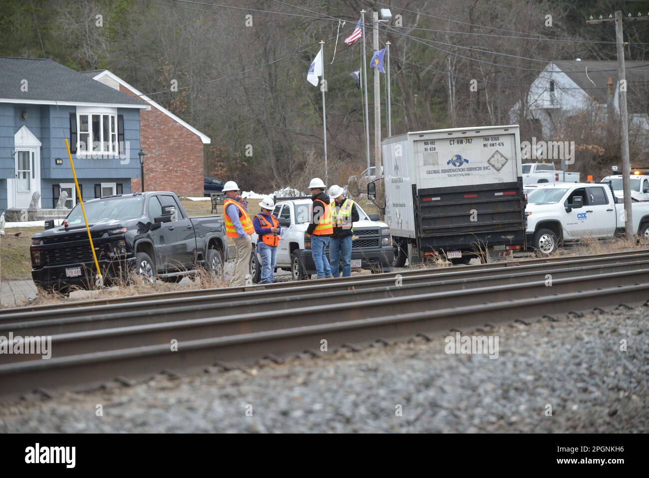 Ayer, Massachusetts, USA. 24th Mar, 2023. Derailed train cars litter the railbed at a derailment of cars operated by Springfield Terminal with Norfolk Southern engines. The cars were hauling solid waste and recyclables, but no hazardous waste as it passed through Ayer center and toppled near a stream in a local neighborhood. Work crews are on the scene and authorities are monitoring the situation. Earlier tracks were closed on both sides but now MBTA commuter trains are operating. (Credit Image: © Kenneth Martin/ZUMA Press Wire) EDITORIAL USAGE ONLY! Not for Commercial USAGE! Stock Photo