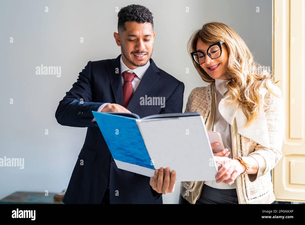 Business partners working on documents in office Stock Photo