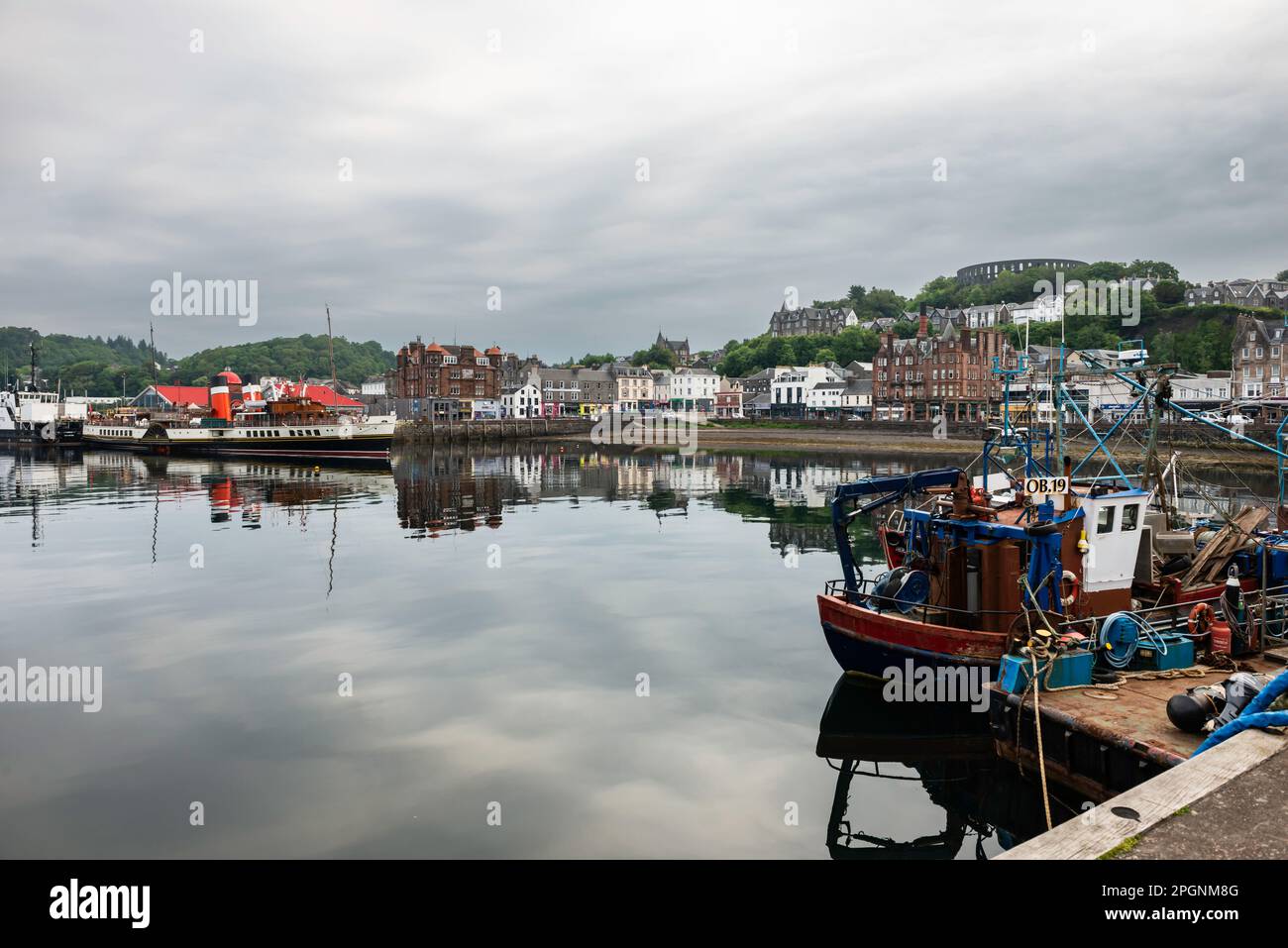 Seagoing Paddle Steamer Waverley moored in Oban Harbour with town and fishing boats Stock Photo