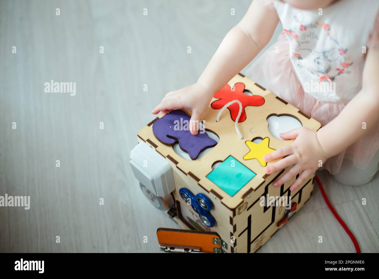 development toy. Place one piece on top of another and move little