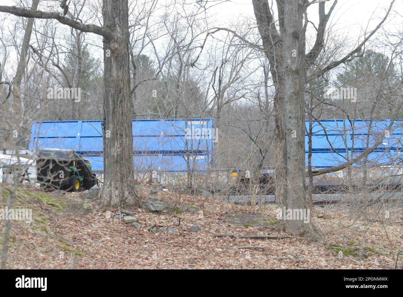 Ayer, Massachusetts, USA. 24th Mar, 2023. Derailed train cars litter