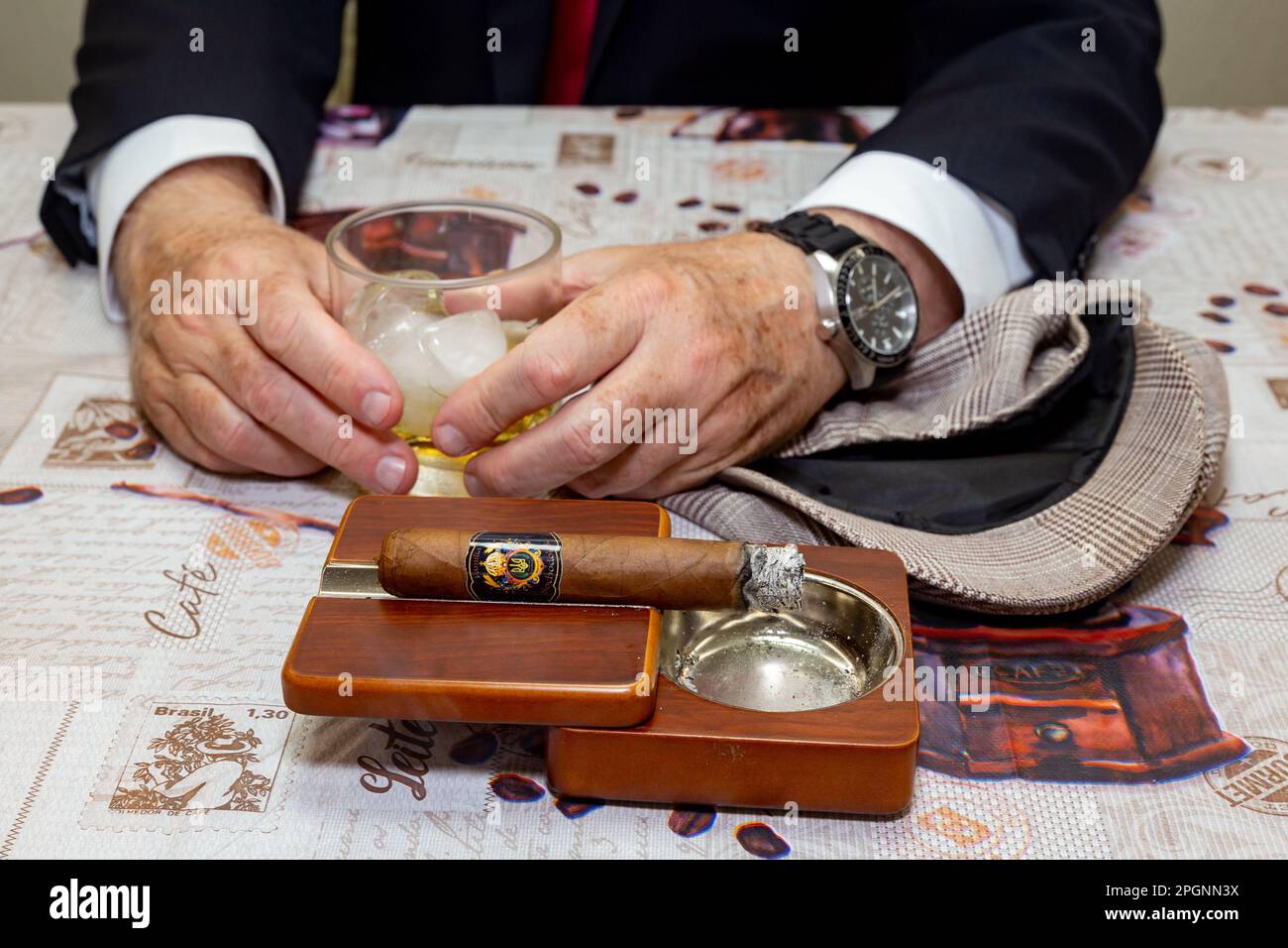 Caucasian elegant man in suit and tie with whiskey and cigar Stock ...