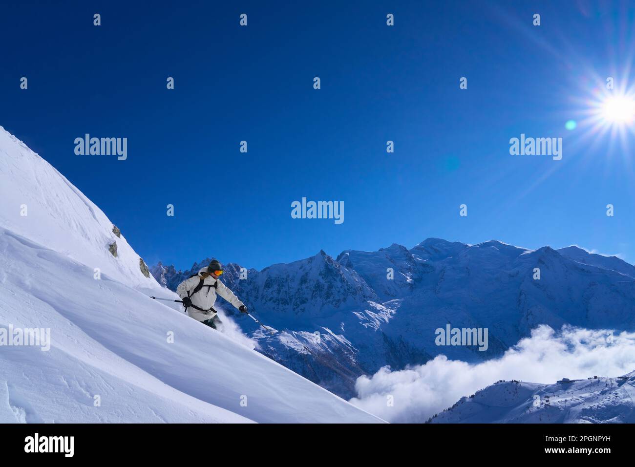 Woman skiing in snow on sunny day Stock Photo