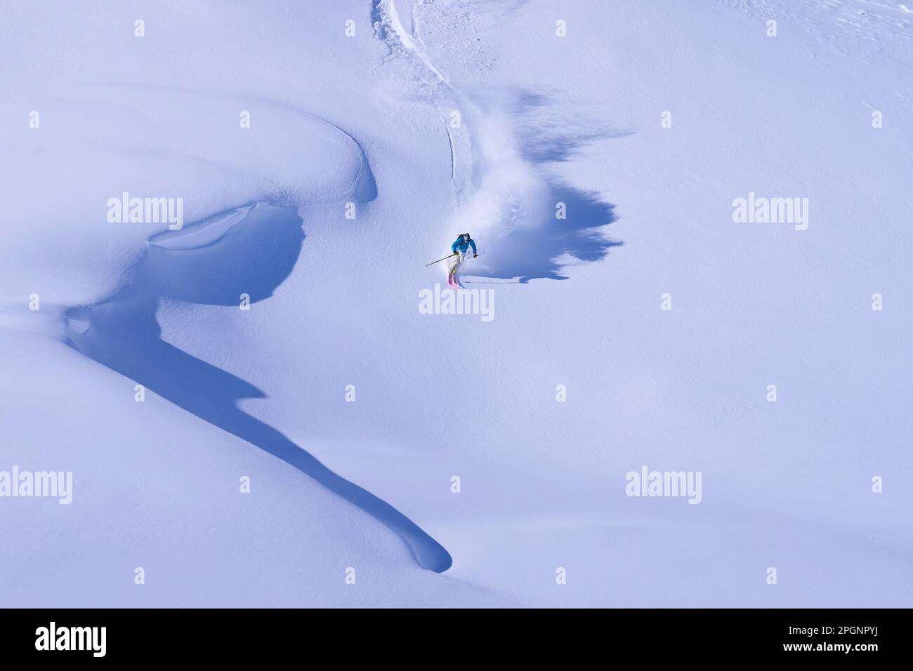 Mature man skiing on snowy mountain Stock Photo