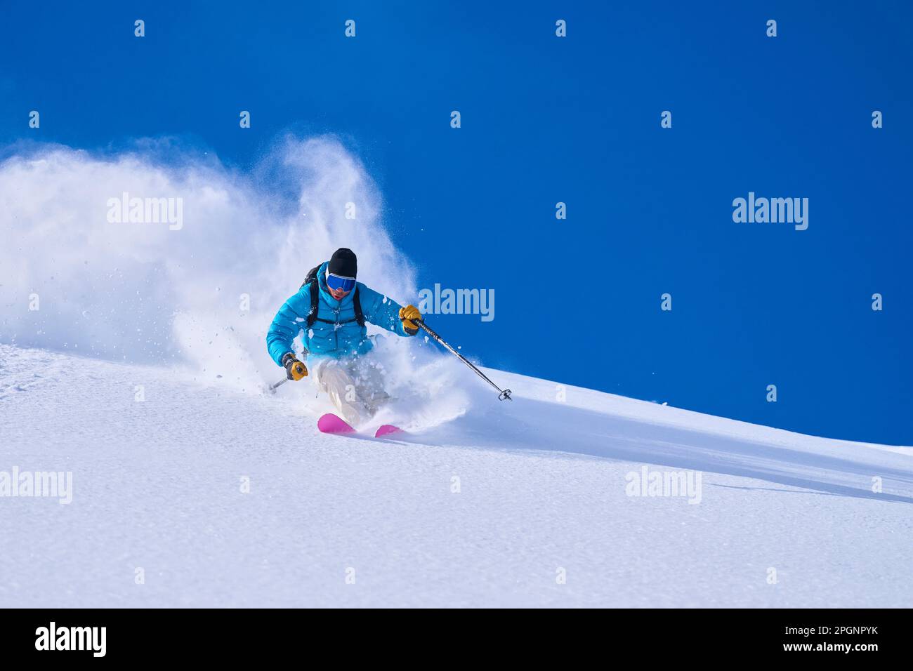 Man skiing on snow covered mountain Stock Photo