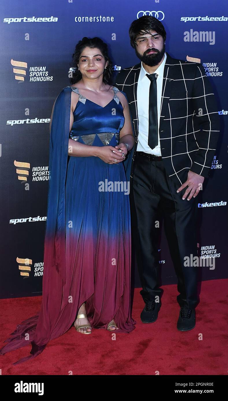 Mumbai, India. 23rd Mar, 2023. L-R Indian wrestler Sakshi Malik and her husband Satyawart Kadian pose for a photo during the Indian Sports Honours red carpet in Mumbai. The award aims to reward excellence in various sports and nurture upcoming talents. Credit: SOPA Images Limited/Alamy Live News Stock Photo