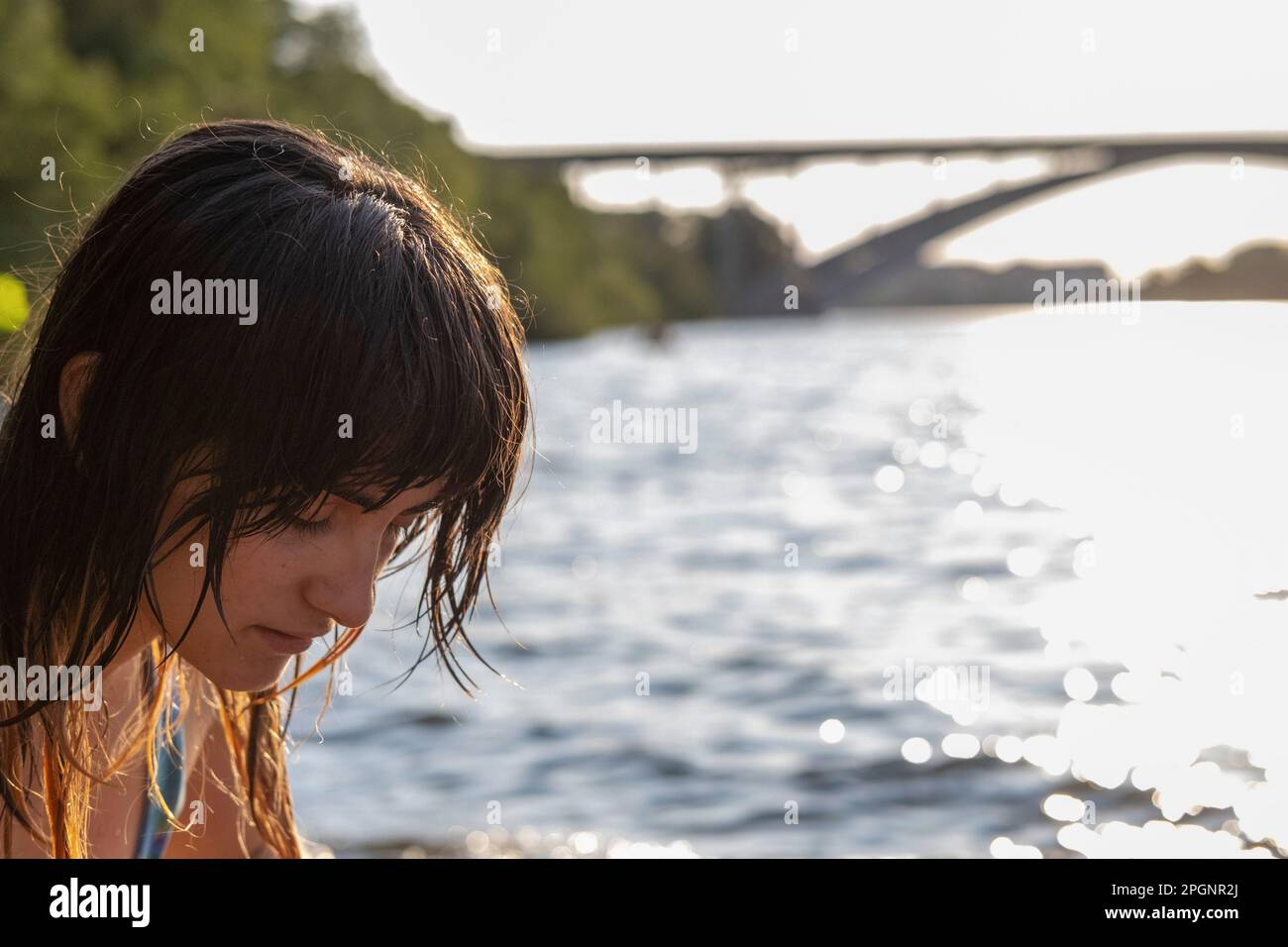 Woman with bangs in front of sea Stock Photo