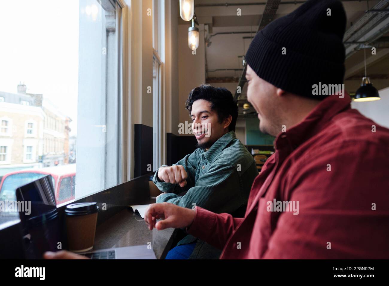 Freelancers working together in cafe Stock Photo