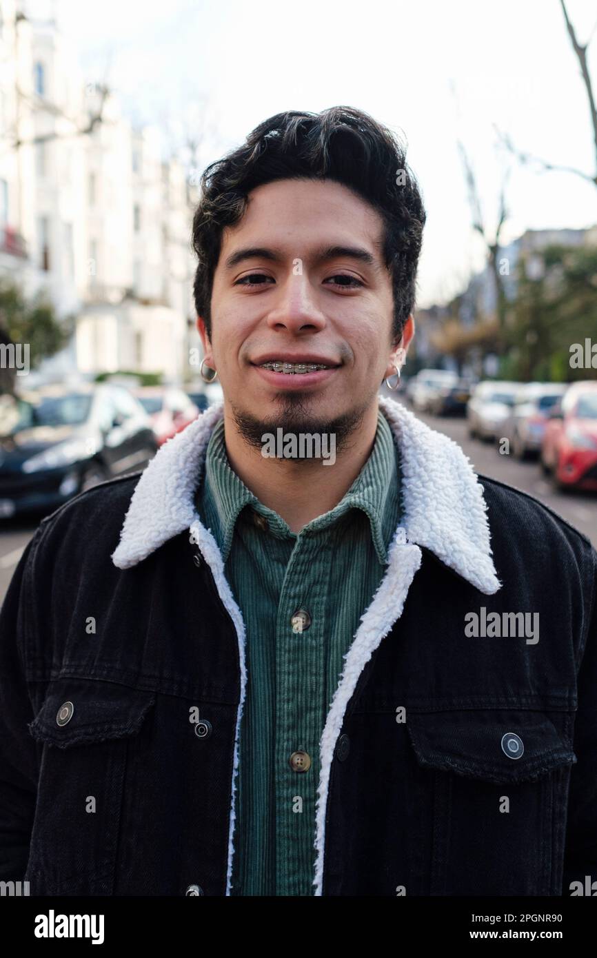 Happy young man standing hi-res stock photography and images - Alamy