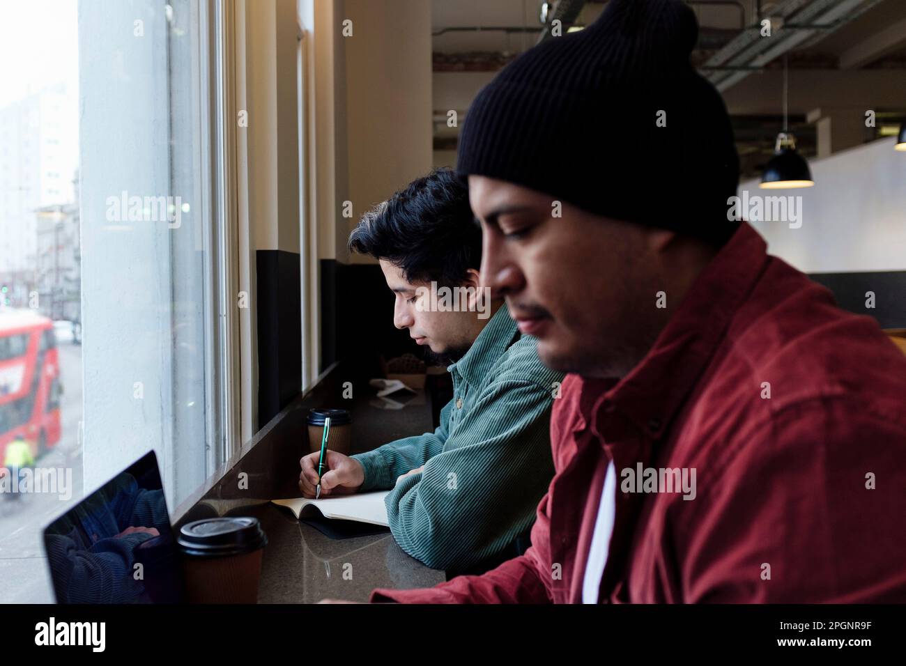 Freelancers working together in cafe Stock Photo