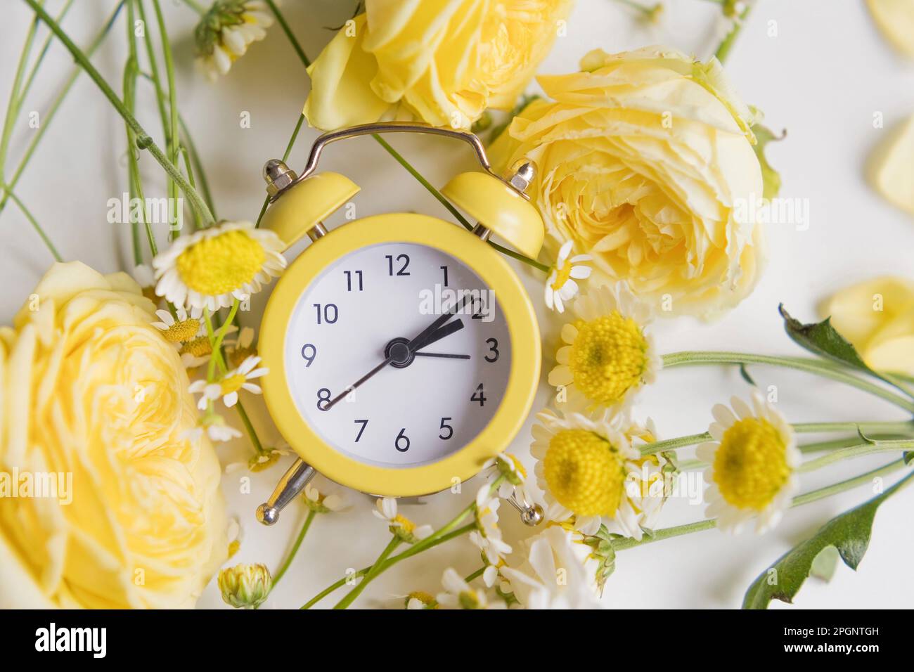 Yellow alarm clock spring hi-res stock photography and images - Alamy