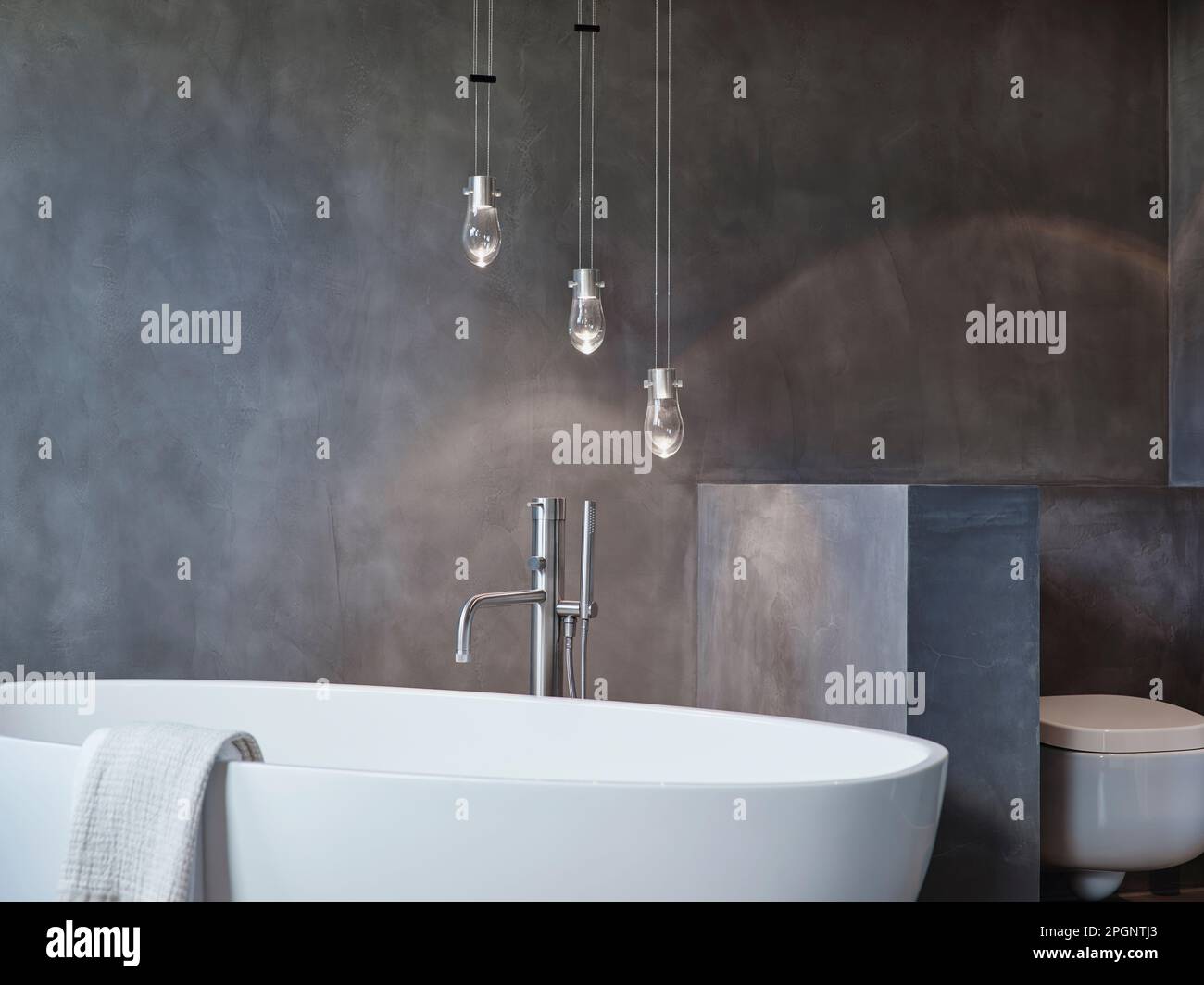 Pendant lights over bathtub in bathroom at home Stock Photo Alamy