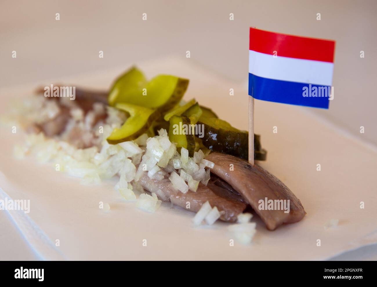 Dutch Herring for Snack with the dutch flag Stock Photo Alamy