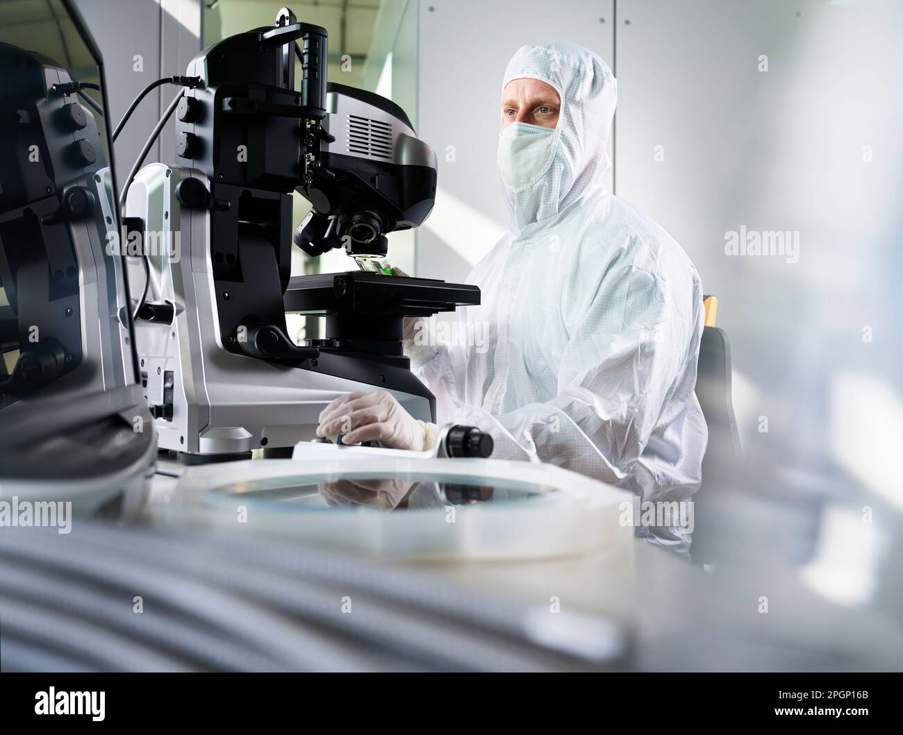 Technician using microscope working in laboratory Stock Photo Alamy