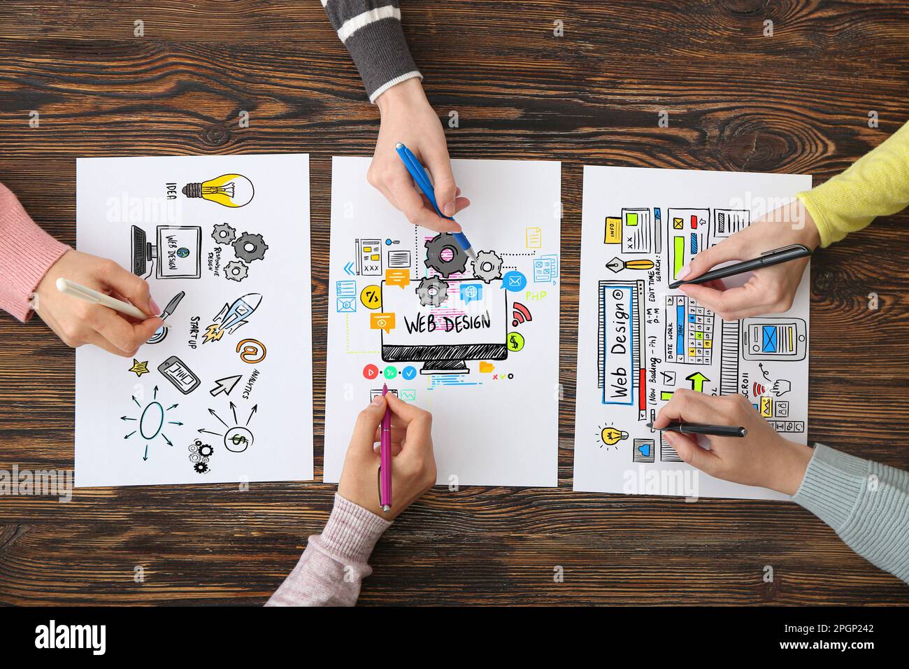Team of web designers working in office, top view Stock Photo