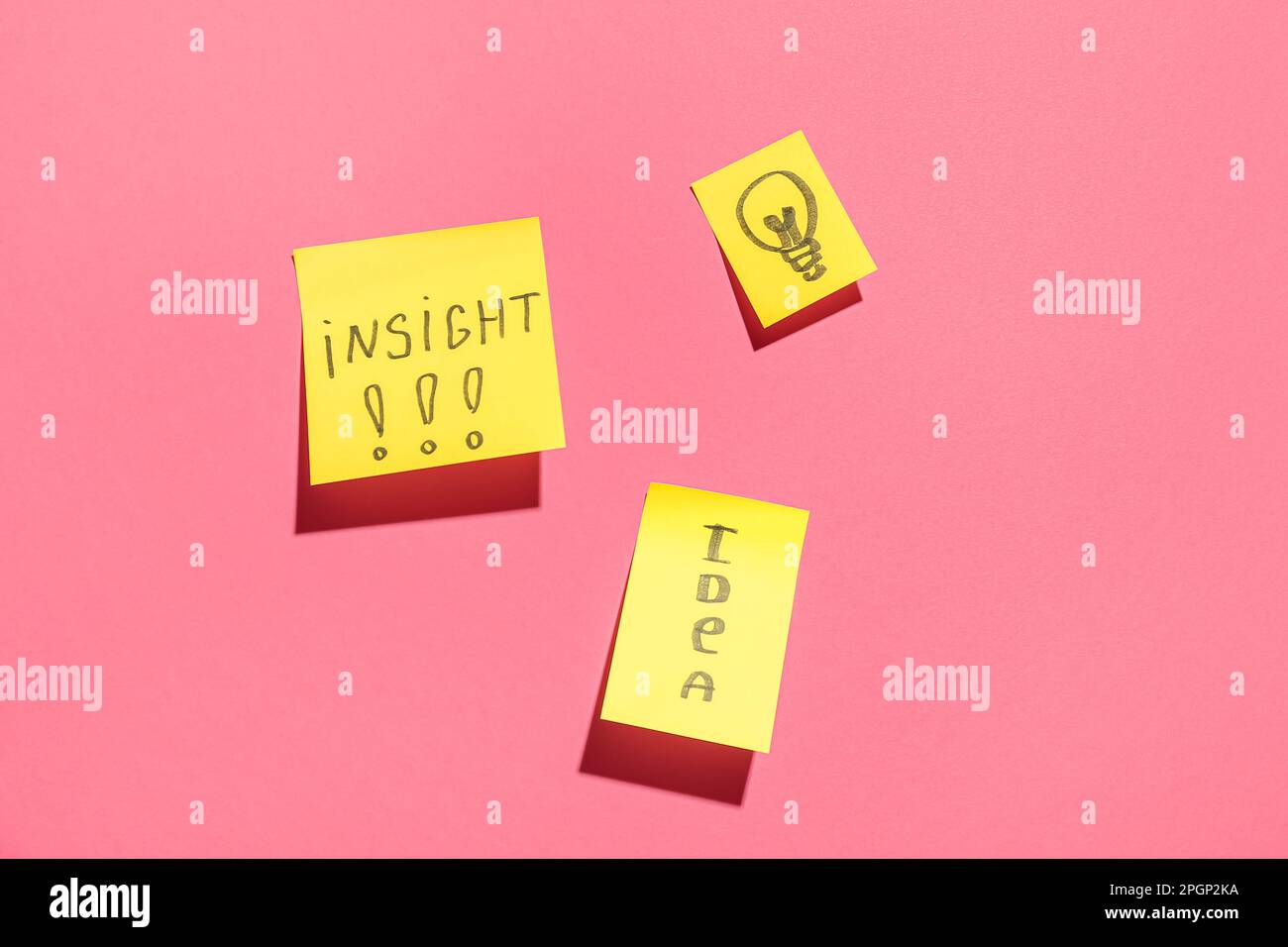 Sticky papers with words and drawn light bulb on pink background ...