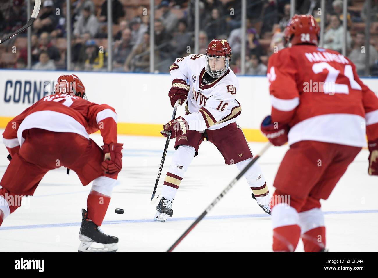 Manchester, New Hampshire, USA. 23rd Mar, 2023. Denver forward Tristan Broz (16) passes the puck