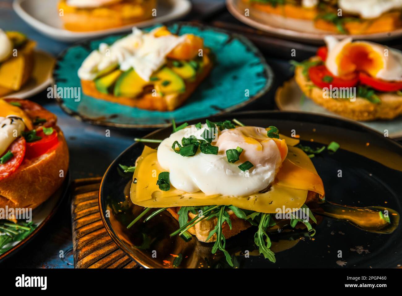 Plates with tasty eggs Benedict on table Stock Photo