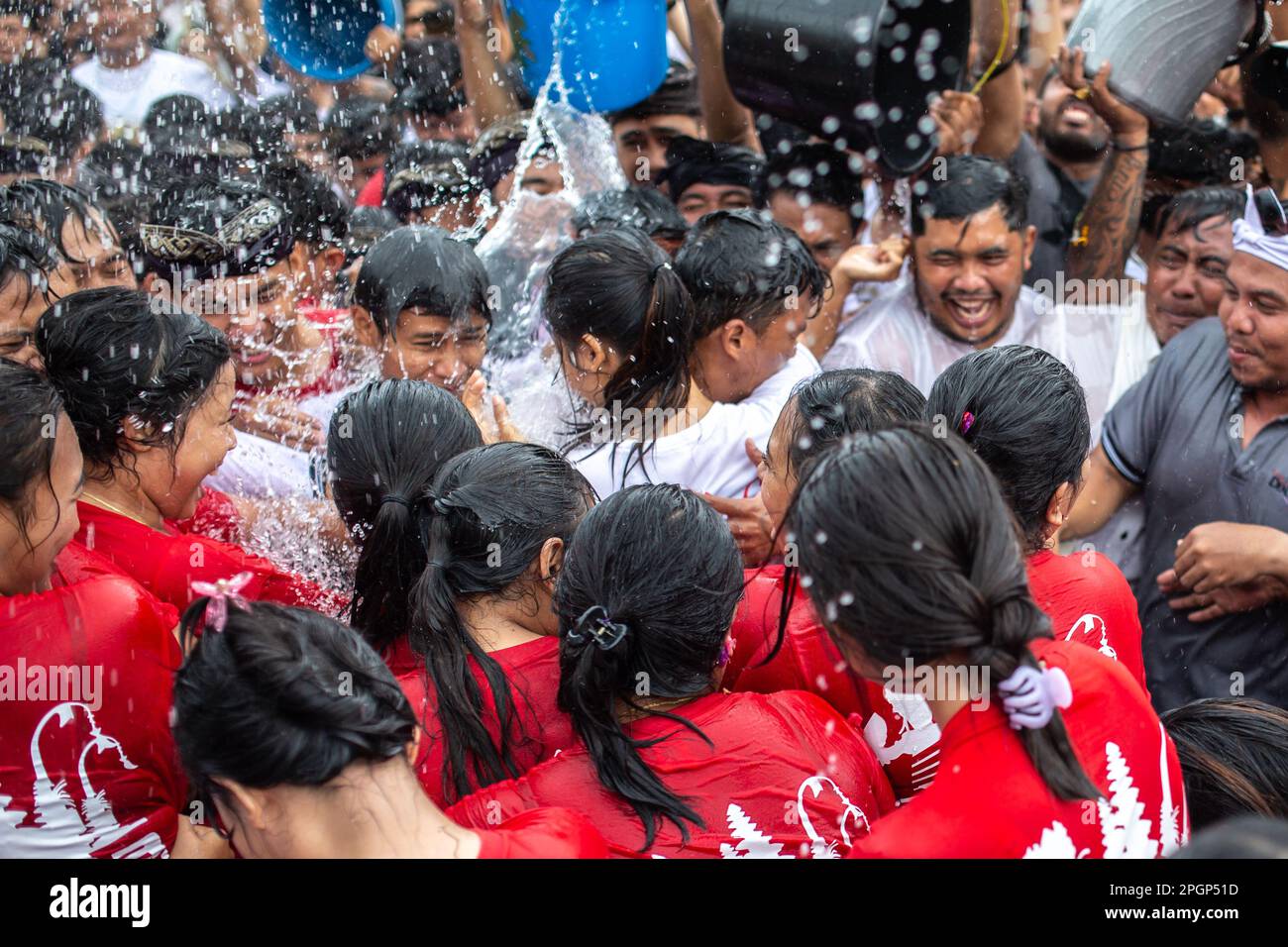 Denpasar, Bali, Indonesia - March 23, 2023: Omed-Omedan festival also known as The Kissing Ritual on the streets of Denpasar, Bali, Indonesia. Stock Photo