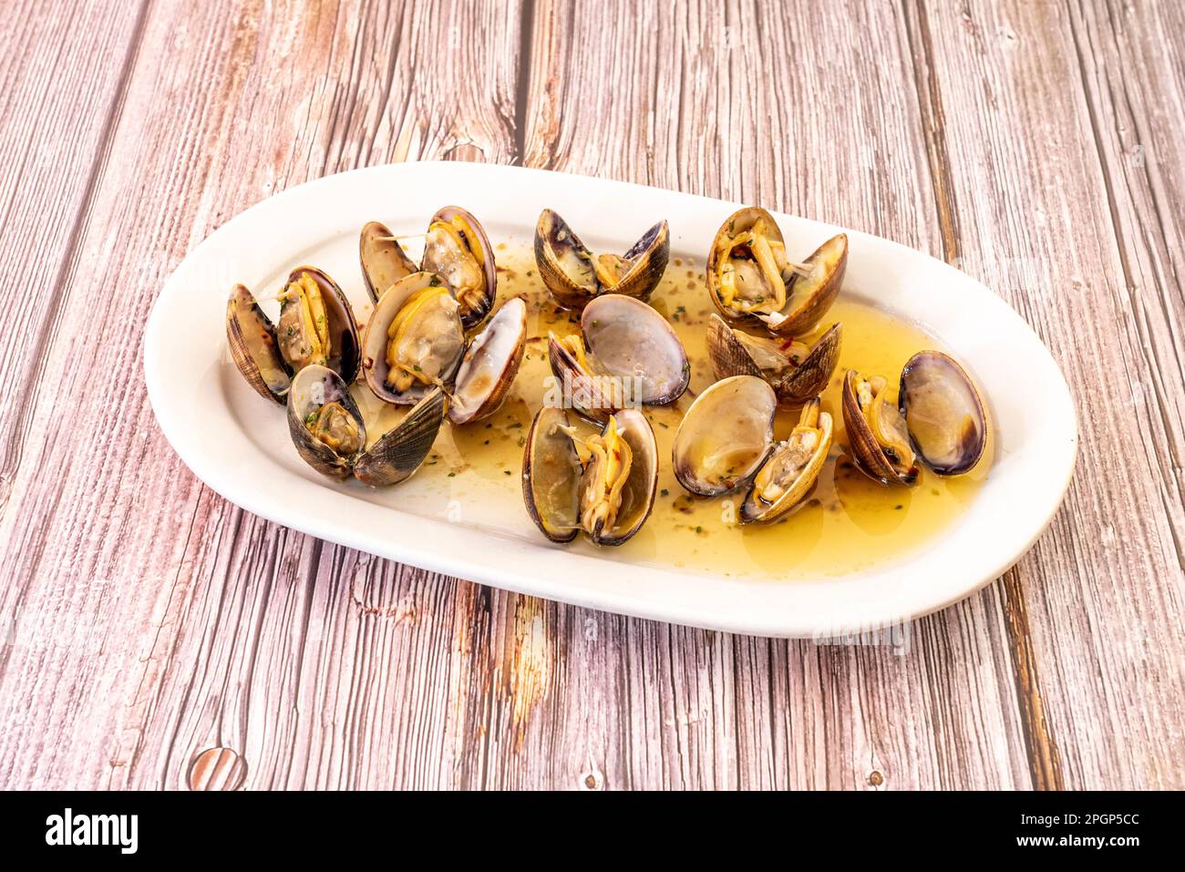 Clams a la marinera are a very typical clam stew of Galician gastronomy, particularly in the Rías Bajas area, being also very popular in other areas o Stock Photo