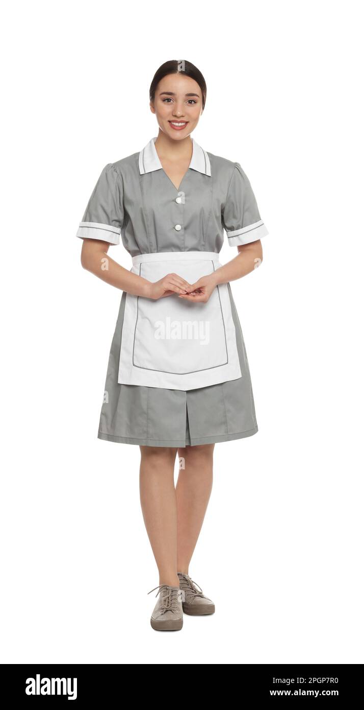 Full length portrait of young chambermaid in tidy uniform on white background Stock Photo