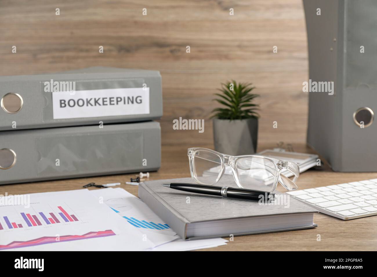 Bookkeeper's workplace with folders and documents on table Stock Photo