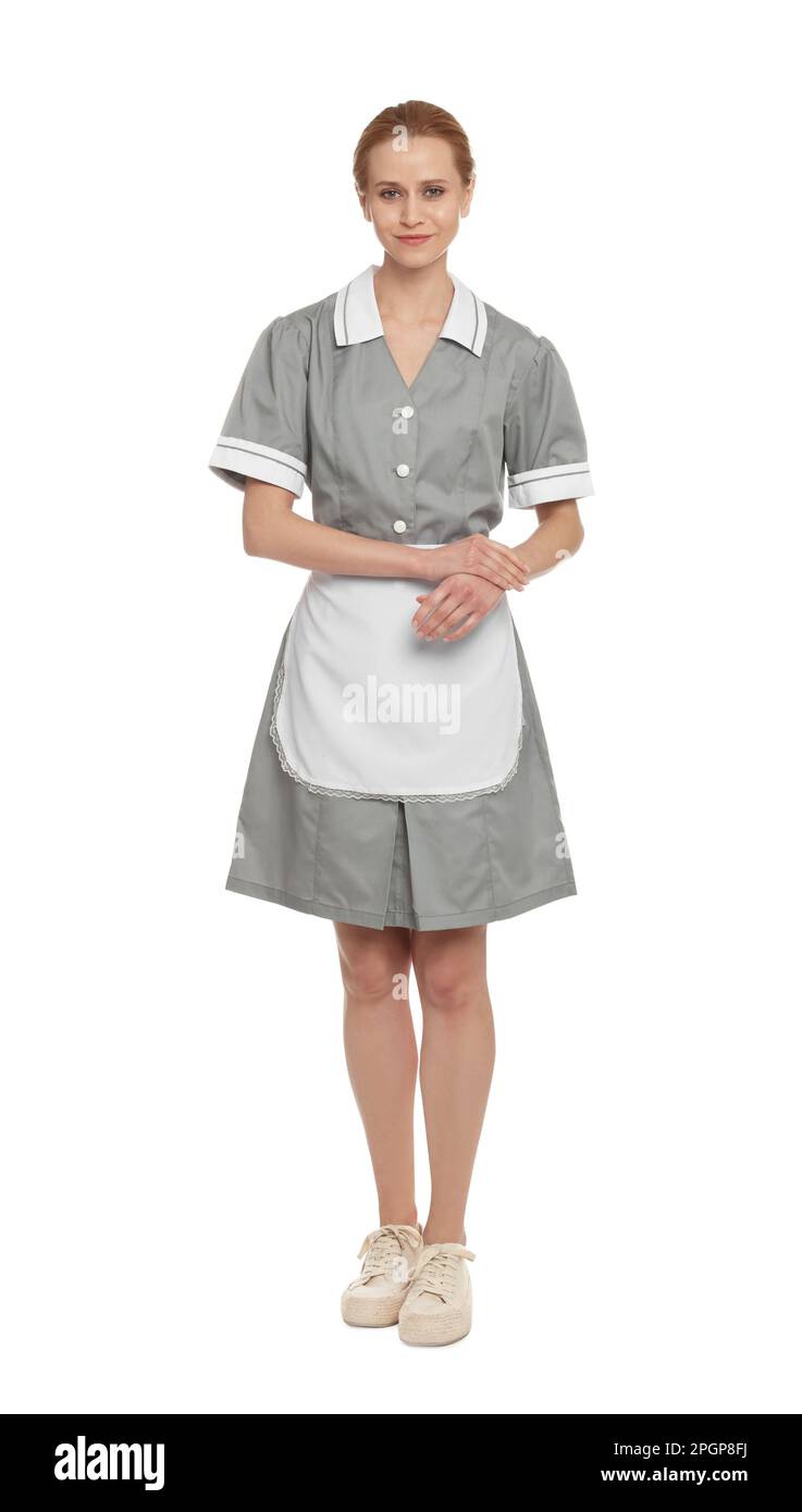 Full length portrait of chambermaid in tidy uniform on white background Stock Photo