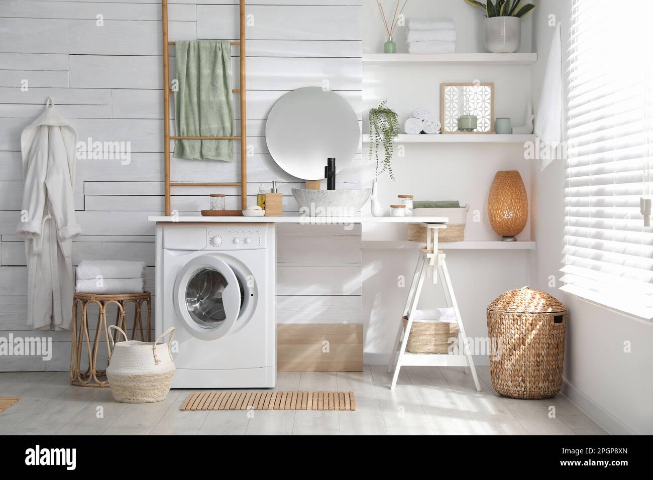Stylish bathroom interior with modern washing machine Stock Photo