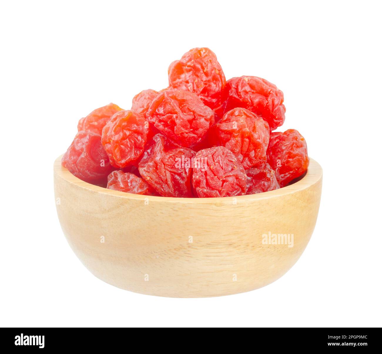 Dried red prunes fruits (Preserved fruits Chinese plum) in wooden bowl